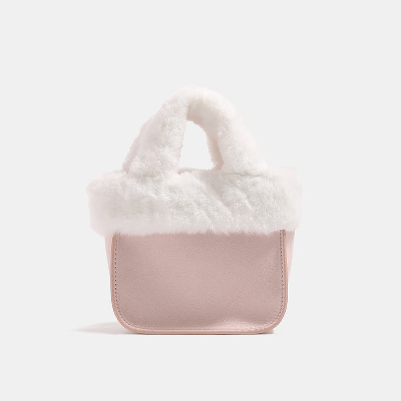 Mini structured handbag with cream faux-fur trim and suede-look textured body, shown with top handles and removable