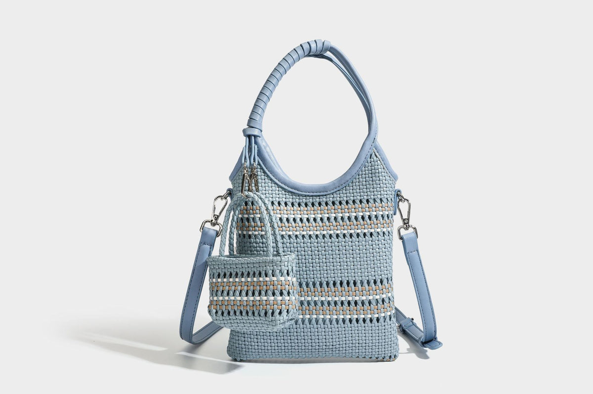 Color-block woven tote bag with rounded leather-look handles, detachable crossbody strap, and matching mini clip-on pouch in