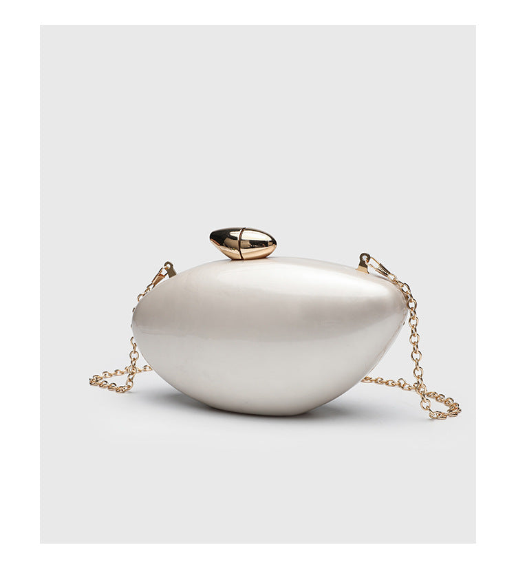 Oval hard-shell marbled gloss clutch bag with gold-tone kiss-lock clasp and detachable gold chain strap, detail view 13