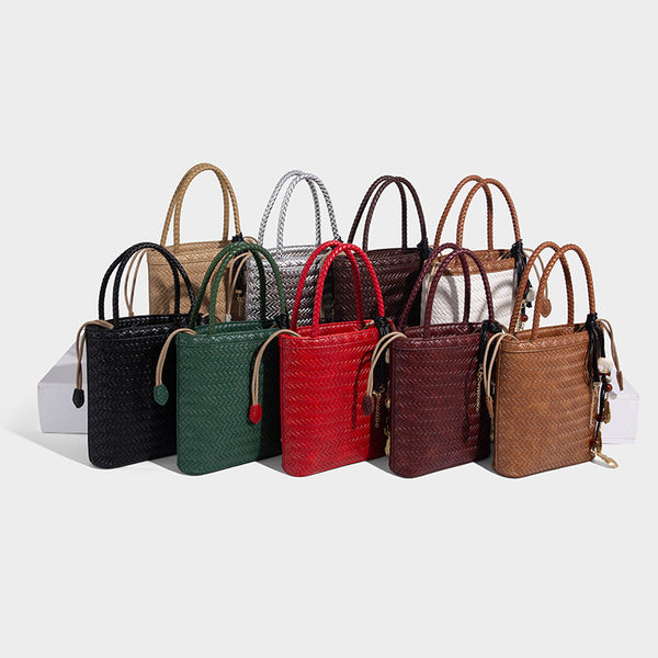 Small structured woven-texture tote bag with braided top handles and drawstring inner pouch, detail view 2