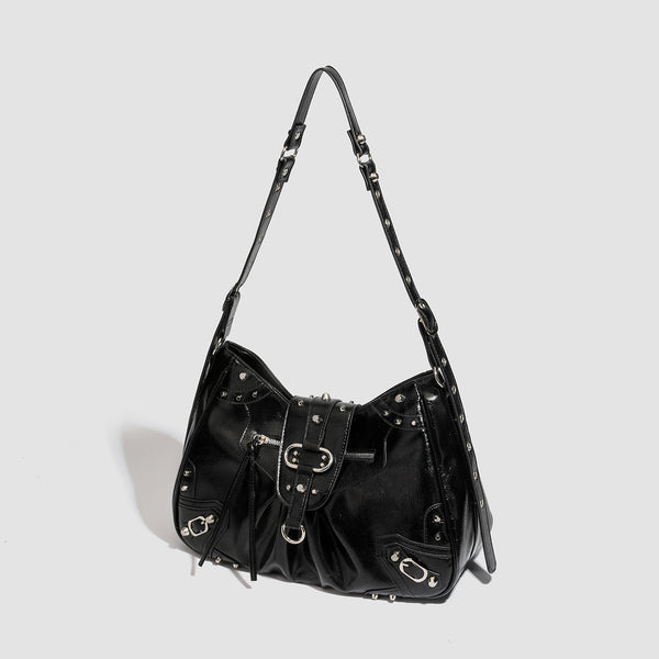 Black glossy studded hobo shoulder bag with silver rivet hardware, front buckle accent, and adjustable strap, detail view 3