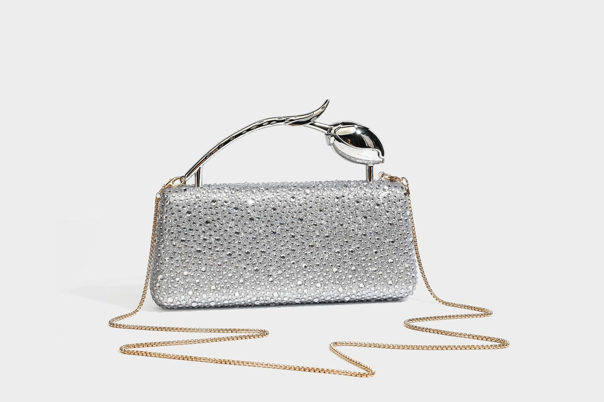 rectangular hard-case rhinestone evening clutch with sculptural gold-tone branch-and-bud top handle and detachable chain