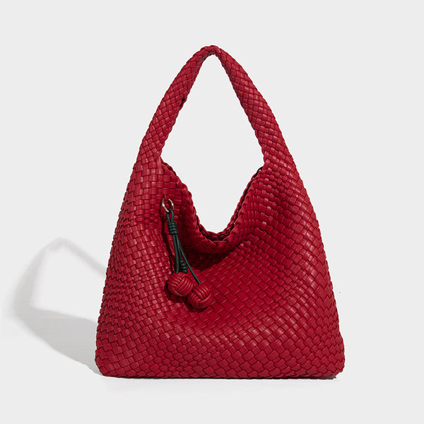 Soft hand-woven slouchy hobo tote bag with knotted tassel charm and single looped shoulder strap, detail view 14