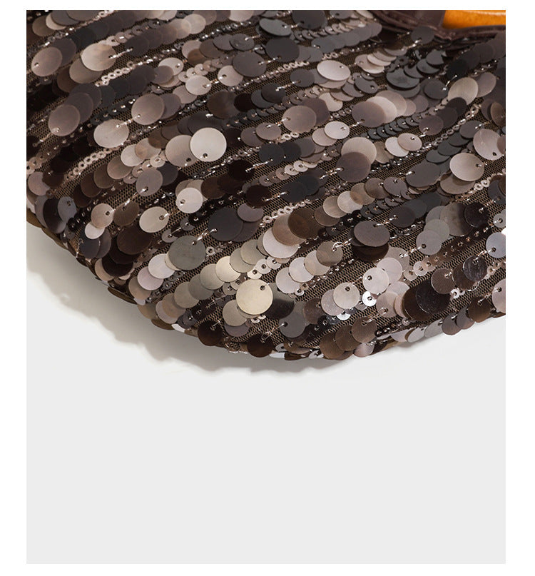 Small sequin half-moon handbag with circular wood-look ring handles and detachable leather-look shoulder strap, detail view