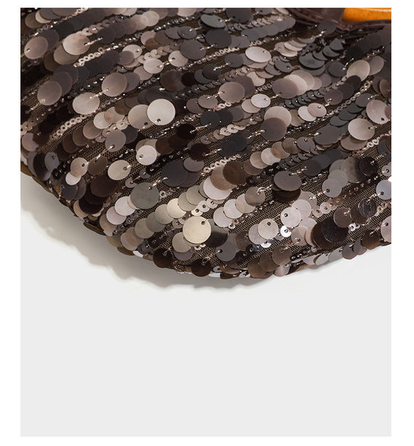 Small sequin half-moon handbag with circular wood-look ring handles and detachable leather-look shoulder strap, detail view