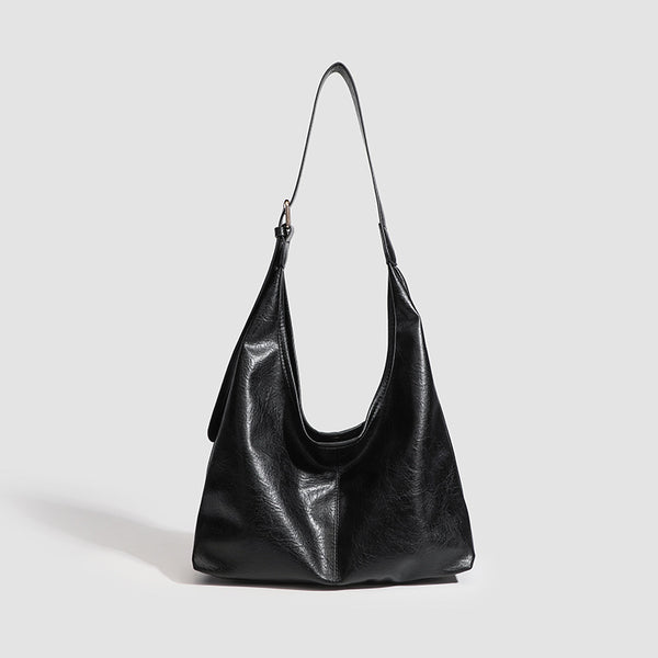 Large slouchy hobo shoulder bag in smooth leather-look finish with adjustable strap and gold-tone hardware, detail view 7