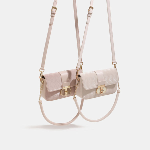 Compact rectangular quilted flap crossbody bag with gold-tone turn-lock closure and chain strap, detail view 2