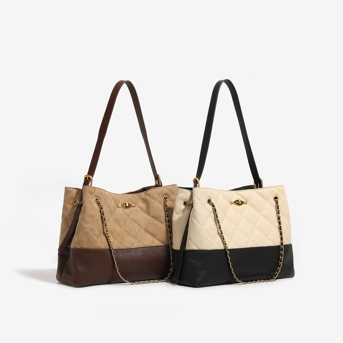 Large quilted two-tone shoulder tote bag with gold-tone chain handles and eye-shaped clasp hardware, detail view 2