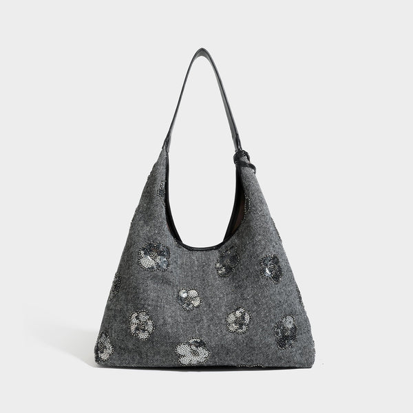 Lässige Trapez-Schulter-Tote in Anthrazit mit floralen Motiven aus silberfarbenen Pailletten, Trageriemen in Lederoptik und herabhängendem, perlenverziertem