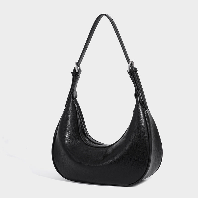 Crescent half-moon shoulder bag in pebbled leather-look finish with adjustable strap and silver-tone hardware, detail view 7