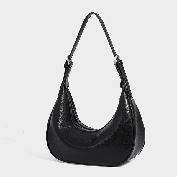 Crescent half-moon shoulder bag in pebbled leather-look finish with adjustable strap and silver-tone hardware, detail view 7