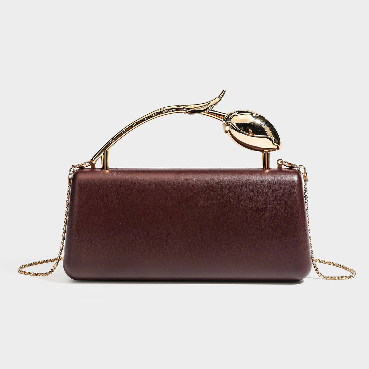 Strukturierte rechteckige Clutch mit Tragegriff in Form einer Rose in Goldoptik und abnehmbarem Kettenriemen in Metallic-Optik, Detailansicht
