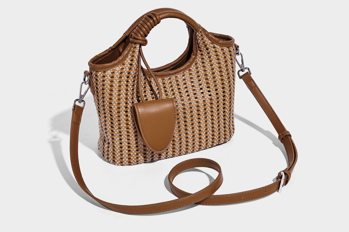 Small structured woven tote crossbody bag with ring top handle, leather-look brown trim, front patch pocket, and detachable