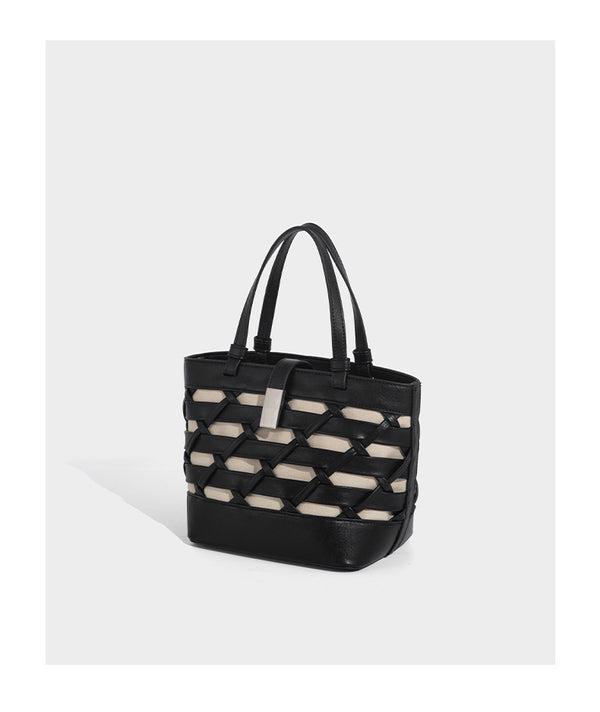Structured woven lattice tote bag with cream lining, dual top handles, detachable crossbody strap, and silver-tone hardware