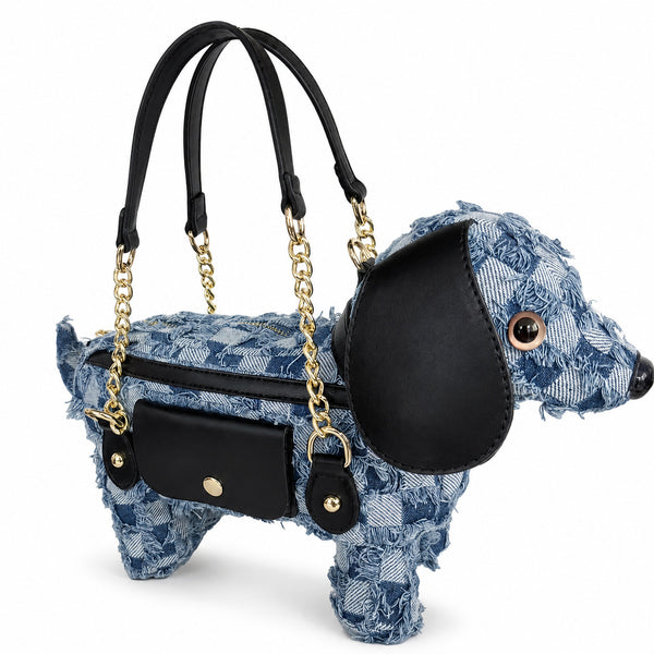 Dachshund-shaped frayed denim patchwork crossbody bag with black leather-look ear, gold-tone chain strap, and front, detail