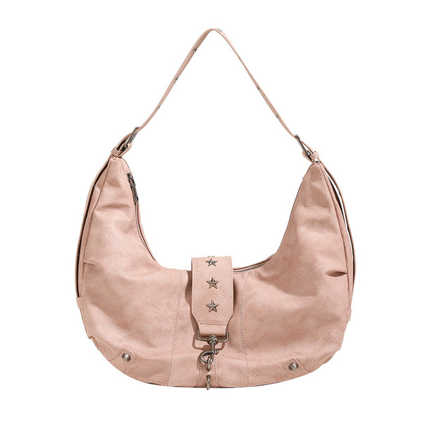 Crescent hobo shoulder bag in matte leather-look finish with star stud front panel, antique-silver hook hardware, and, detail