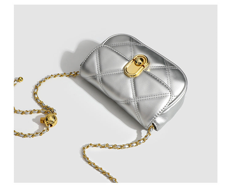 Compact diamond-quilted mini crossbody bag with gold-tone turn-lock closure and woven chain strap, detail view 18