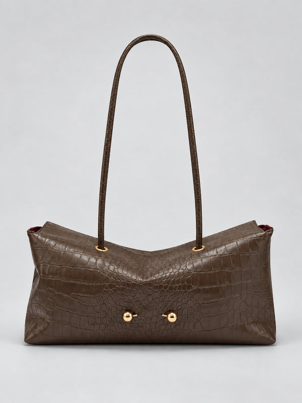 Wide embossed-texture shoulder tote bag with single loop handle and gold-tone toggle hardware, detail view 34