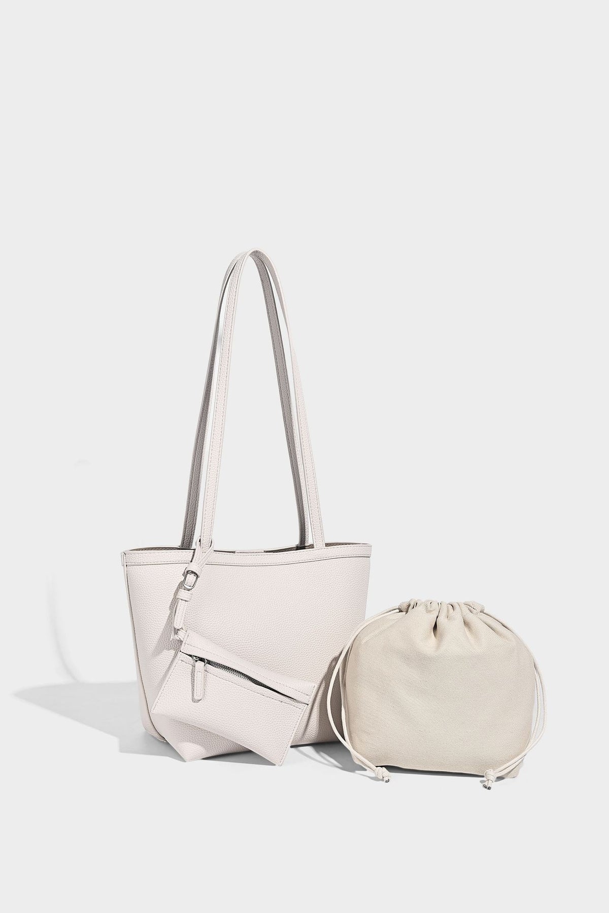 Structured pebbled leather-look tote bag in taupe with long shoulder strap, detachable zip pouch, and pink tulip flower