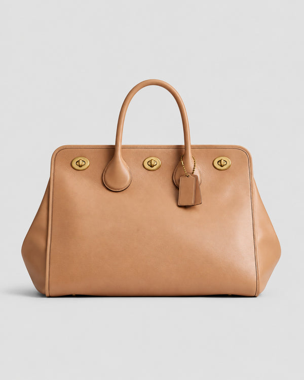 Structured leather-look tote bag with three gold-tone turn-lock closures and double rolled top handles, detail view 20