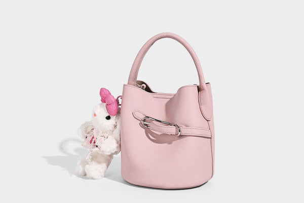Mini pebbled leather-look bucket bag with front buckle strap, silver-tone hardware, top handle, and detachable shoulder