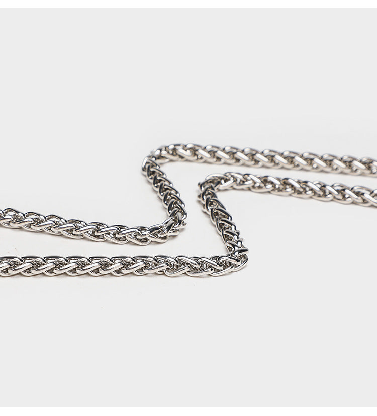 Structured mini flap crossbody bag covered in grid-set rhinestones with silver-tone chain strap, detail view 12