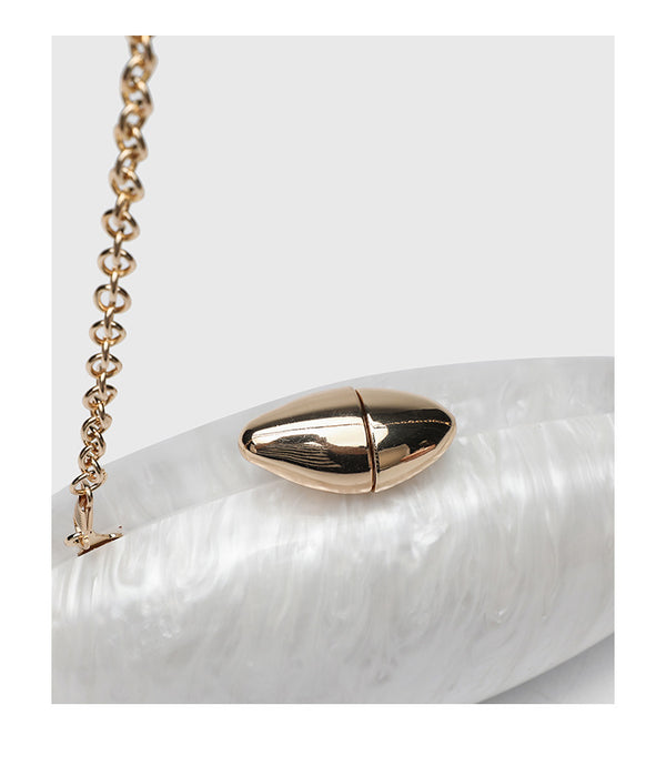 Oval hard-shell marbled gloss clutch bag with gold-tone kiss-lock clasp and detachable gold chain strap, detail view 16