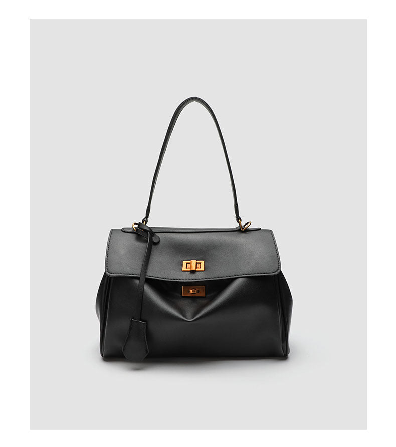 Structured black leather-look flap satchel bag with silver turn-lock hardware and top handle, detail view 20