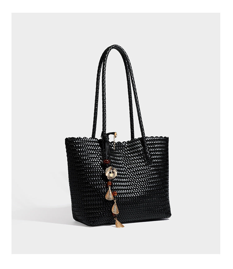 Large open-top woven leather-look tote bag in dark brown with scalloped edge, braided double shoulder straps, and decorative