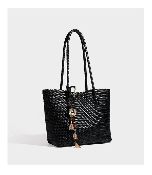 Large open-top woven leather-look tote bag in dark brown with scalloped edge, braided double shoulder straps, and decorative