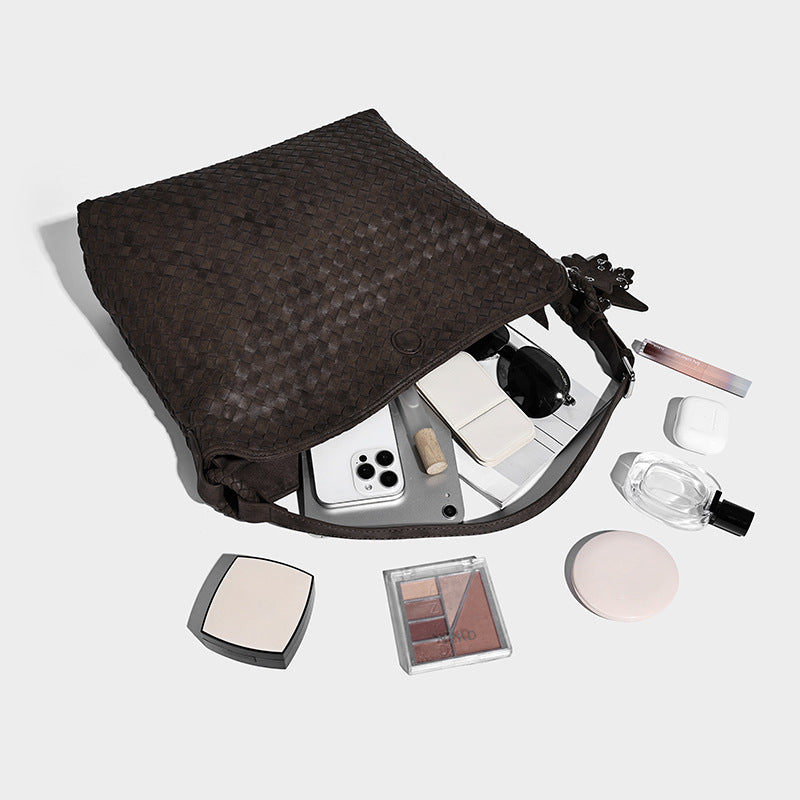 Large soft woven hobo shoulder bag with matte textured finish, adjustable strap, and star charm hardware, detail view 4