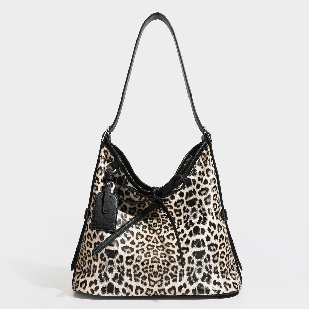 Slouchy leopard print shoulder hobo bag with black leather-look trim, tie-top closure, and single long strap, detail view 28