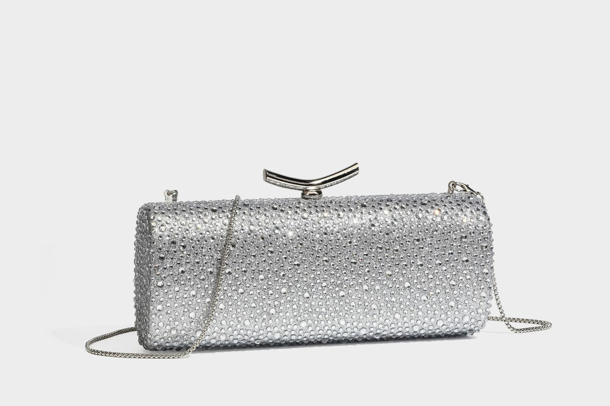 Structured rectangular hard-case clutch bag covered in all-over rhinestone crystal embellishment with curved kiss-lock top