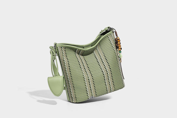Woven bucket shoulder bag with leather-look trim, silver-tone hardware, and beaded tassel charm, detail view 23