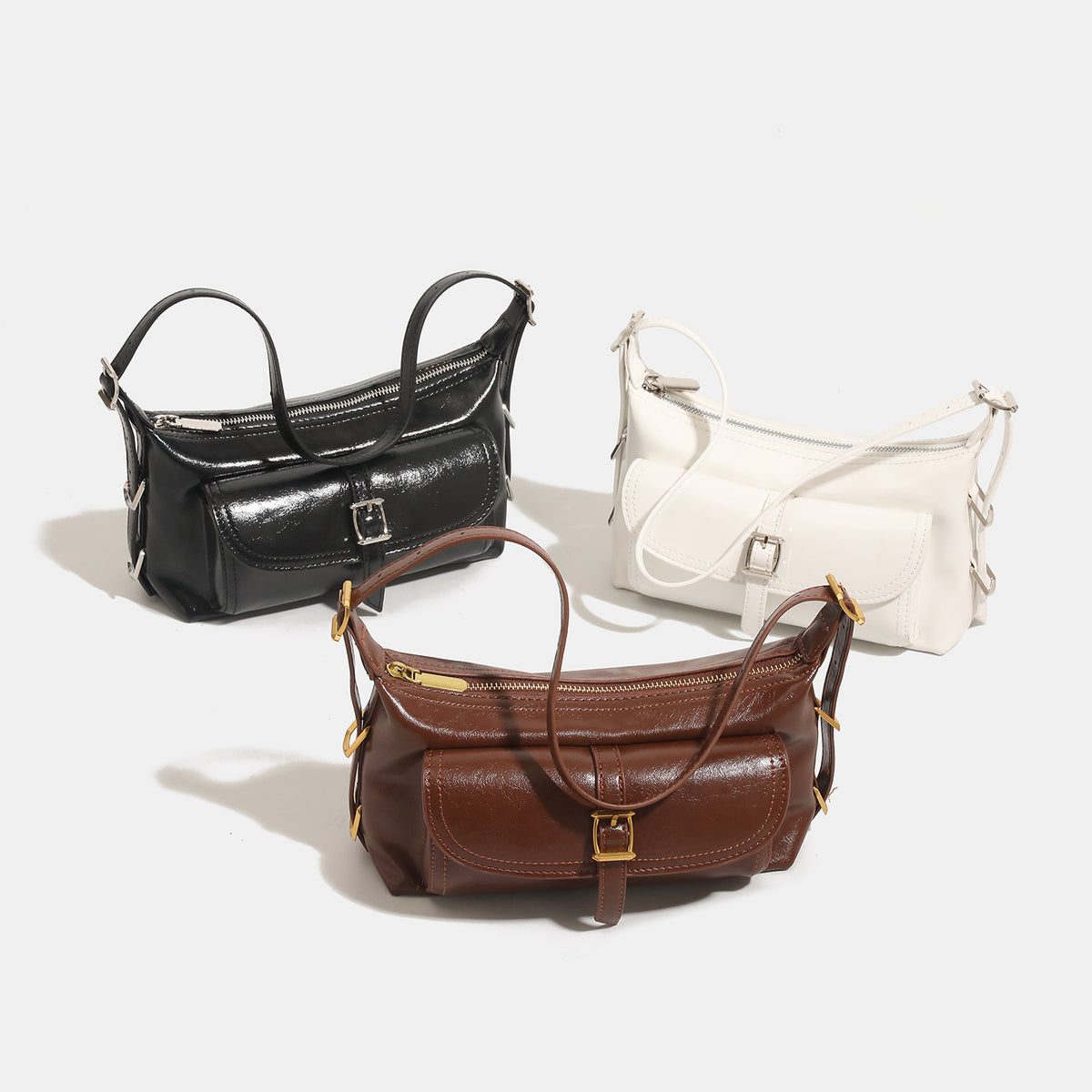 Compact glossy oil-wax leather-look shoulder bag with front buckle flap pocket and gold-tone hardware, detail view 2