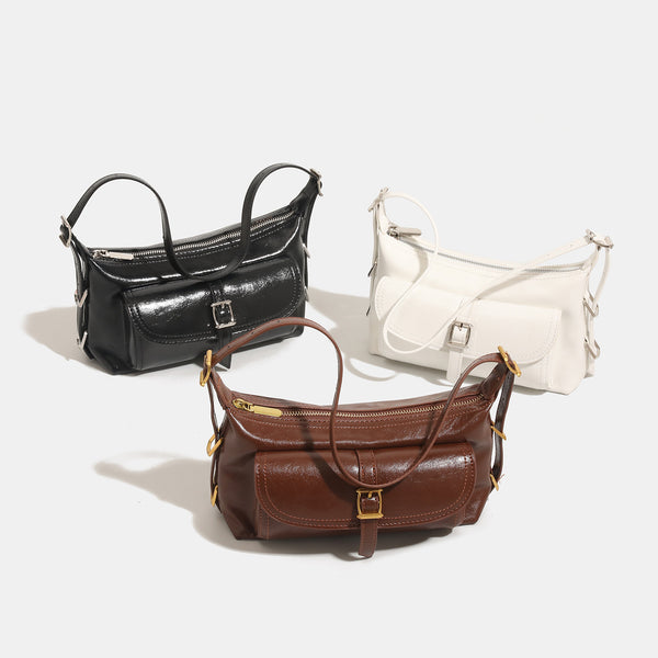 Compact glossy oil-wax leather-look shoulder bag with front buckle flap pocket and gold-tone hardware, detail view 2