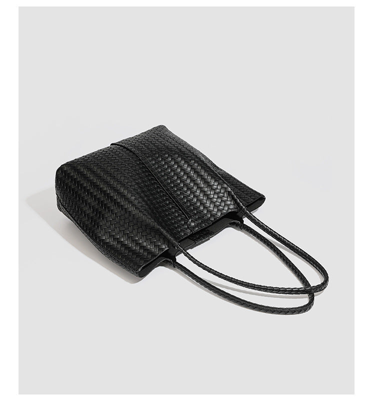 Large black basket-weave leather-look tote bag with long braided shoulder straps and matching woven zip pouch, detail view 16