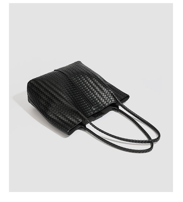 Large black basket-weave leather-look tote bag with long braided shoulder straps and matching woven zip pouch, detail view 16