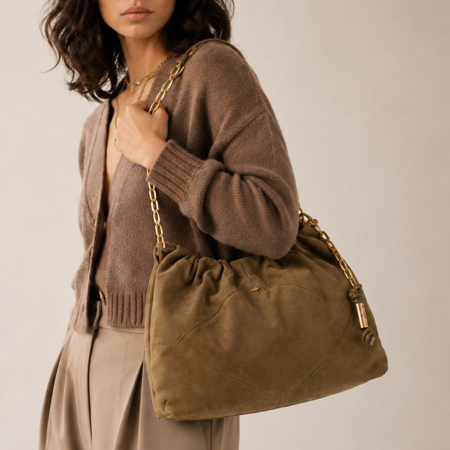 Slouchy suede-look shoulder bag with gathered top, angular stitched paneling, and chunky gold-tone chain strap, detail view 3