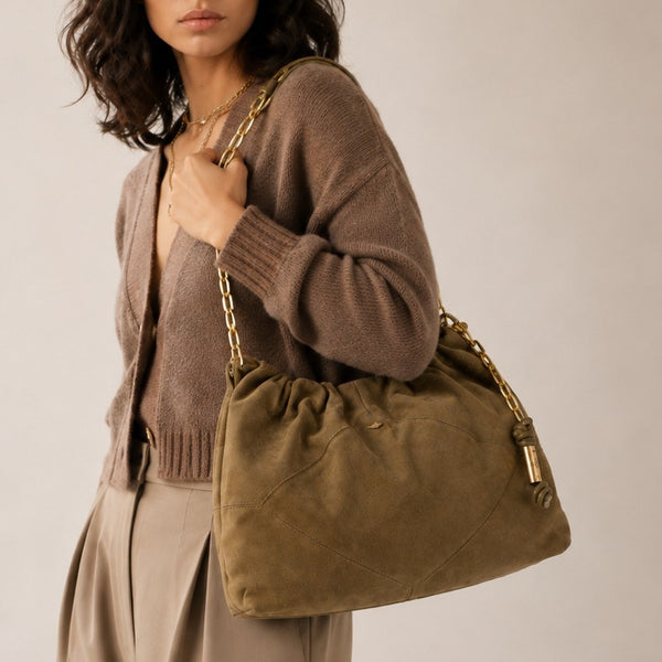 Slouchy suede-look shoulder bag with gathered top, angular stitched paneling, and chunky gold-tone chain strap, detail view 3