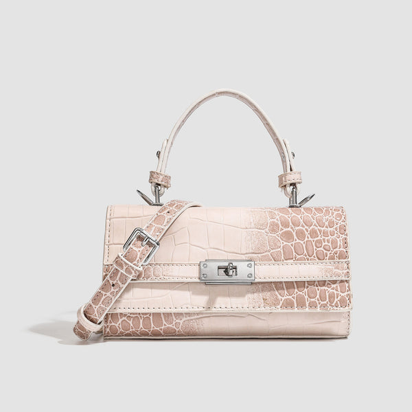 Mini-Handtasche mit strukturierter, rechteckiger Form, glänzender Krokodilprägung in Lederoptik, Drehverschluss in Silberoptik und kurzem