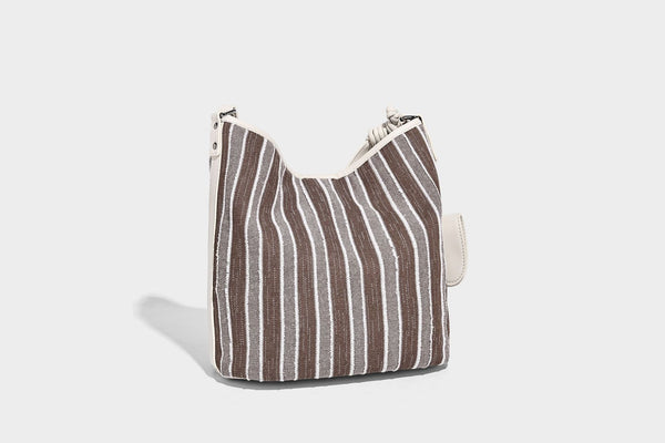 Large striped canvas hobo shoulder bag with cream trim and silver-tone hardware, detail view 15