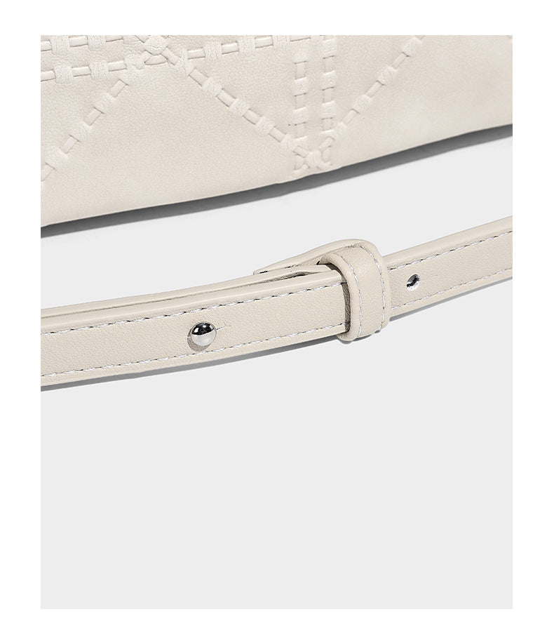 Diamond-quilted leather-look bucket shoulder bag with knotted strap accent and attached mini pouch, detail view 14