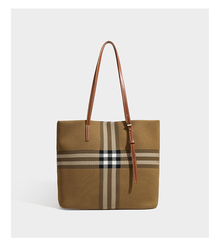Large structured plaid check tote bag with smooth tan leather-look shoulder straps, attached front zip pouch, and gold-tone