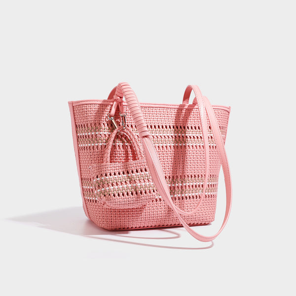 Large structured woven tote bag with striped basket-weave finish, long shoulder straps, and detachable mini pouch charm