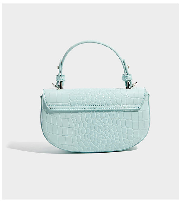 Glossy croc-embossed mini saddle bag with silver-tone turn-lock clasp and short top handle, detail view 10