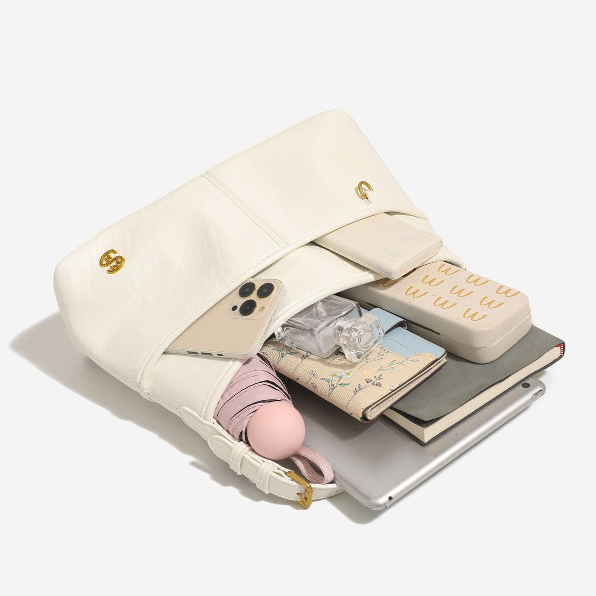 Relaxed leather-look shoulder tote bag in cream white with front exterior pocket, gold-tone ring hardware, and adjustable
