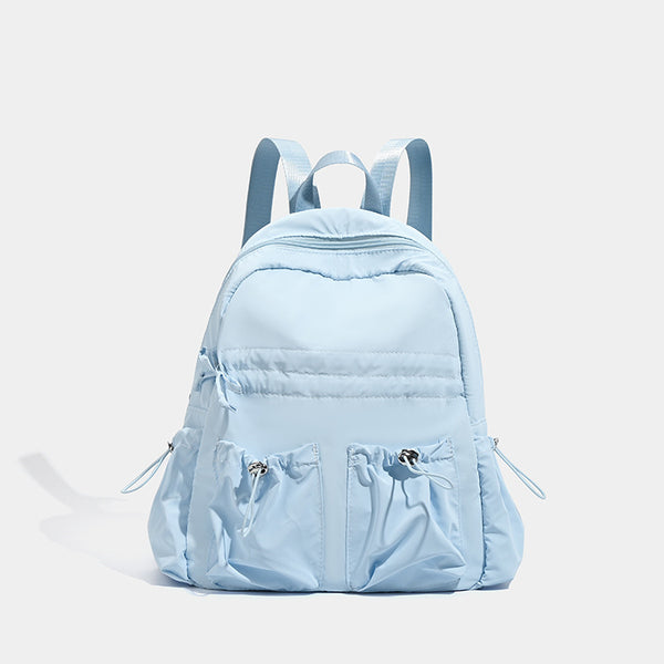 Puffy matte nylon mini backpack with drawcord gathered front pockets and silver-tone hardware, detail view 7