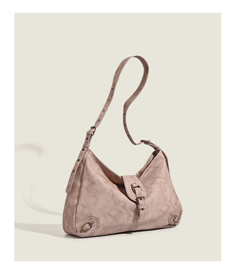 Slouchy distressed leather-look hobo bag with antique brass buckle closure and adjustable shoulder strap, detail view 11