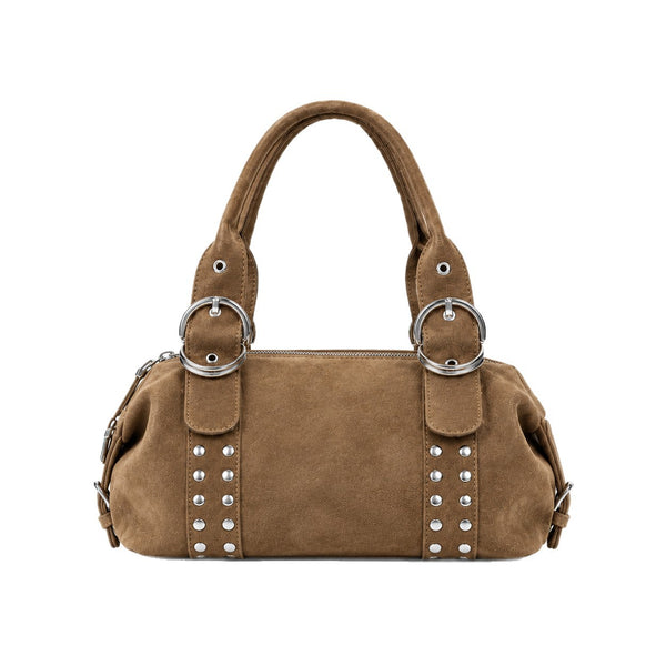 Matte suede-finish barrel bag with silver stud panels, oversized ring hardware, and dual top handles, detail view 5